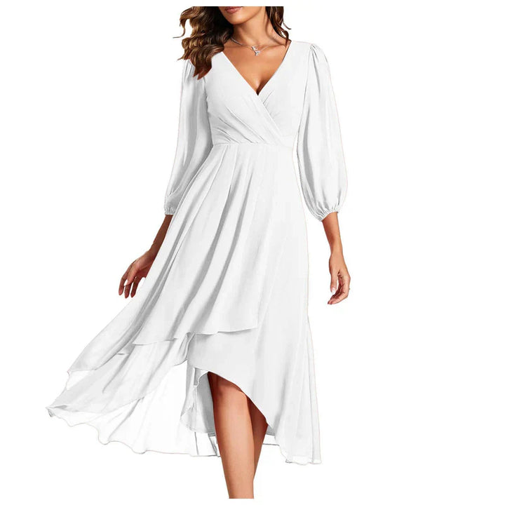 VITTORIA | Elegant dress with asymmetric hem and flowing sleeves. Refined look for any occasion